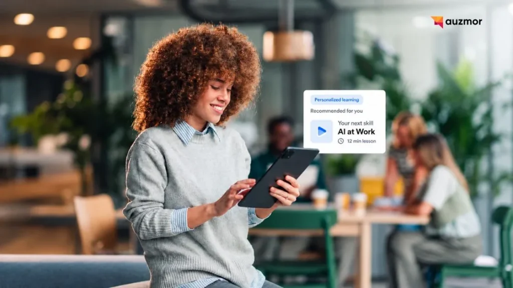 Smiling employee on a tablet showing a personalized learning recommendation, AI at Work